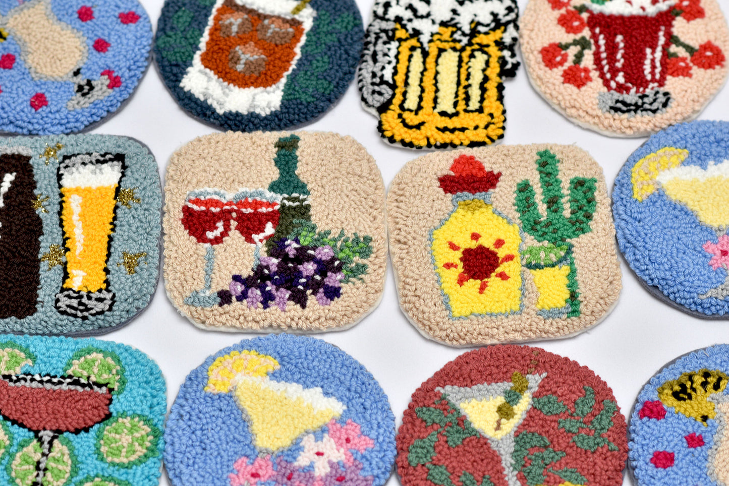 Collection of colorful coasters with various designs on a white background