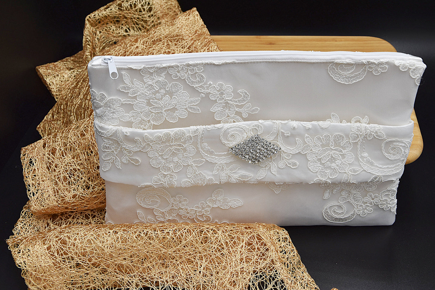 Bridal clutch bag in white lace with rhinestone brooch
