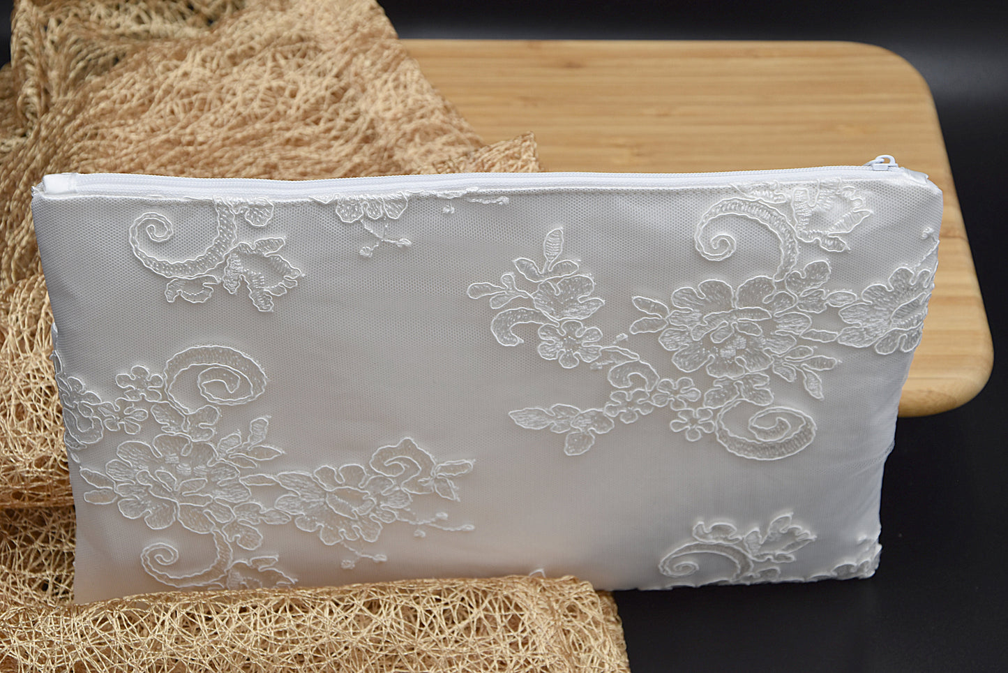 Bridal clutch bag in white lace with rhinestone brooch