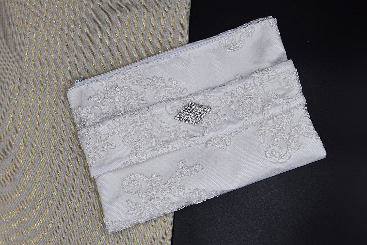 Bridal clutch bag in white lace with rhinestone brooch