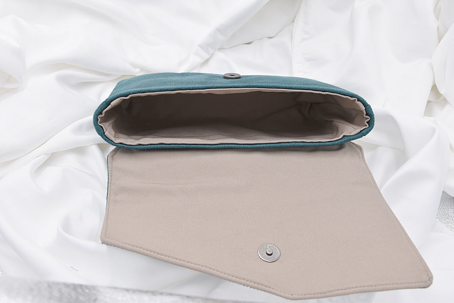 Green faux leather clutch bag with rhinestone effect shiny band