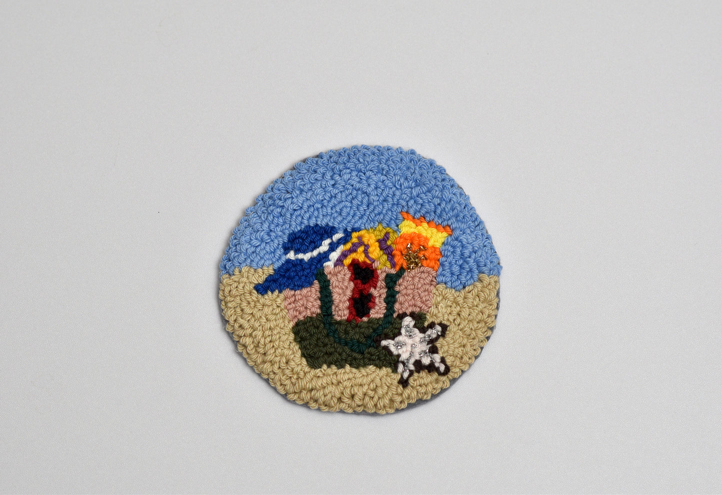 Decorative rug with a beach scene design on a gray background