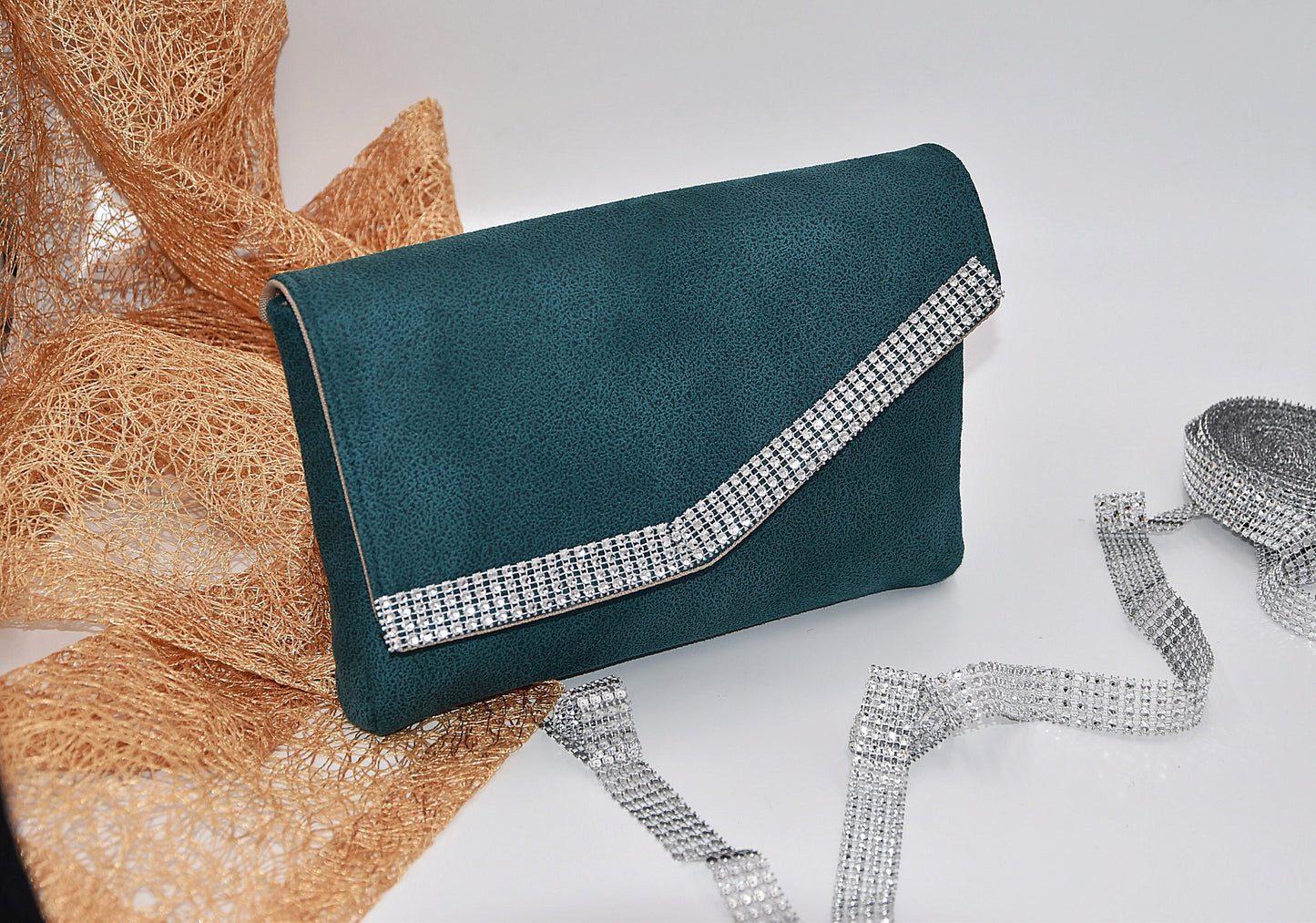 Green faux leather clutch bag with rhinestone effect shiny band