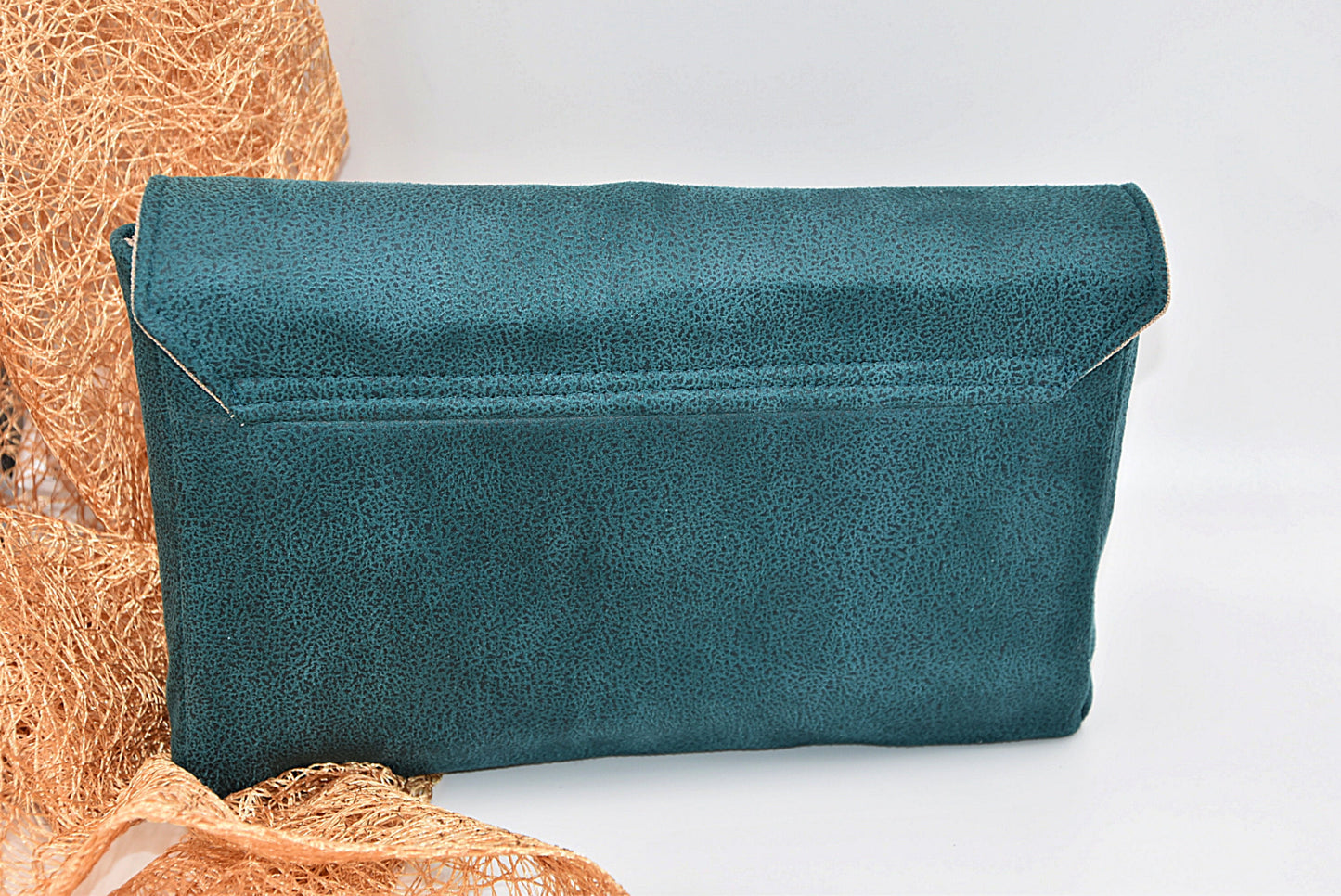 Green faux leather clutch bag with rhinestone effect shiny band