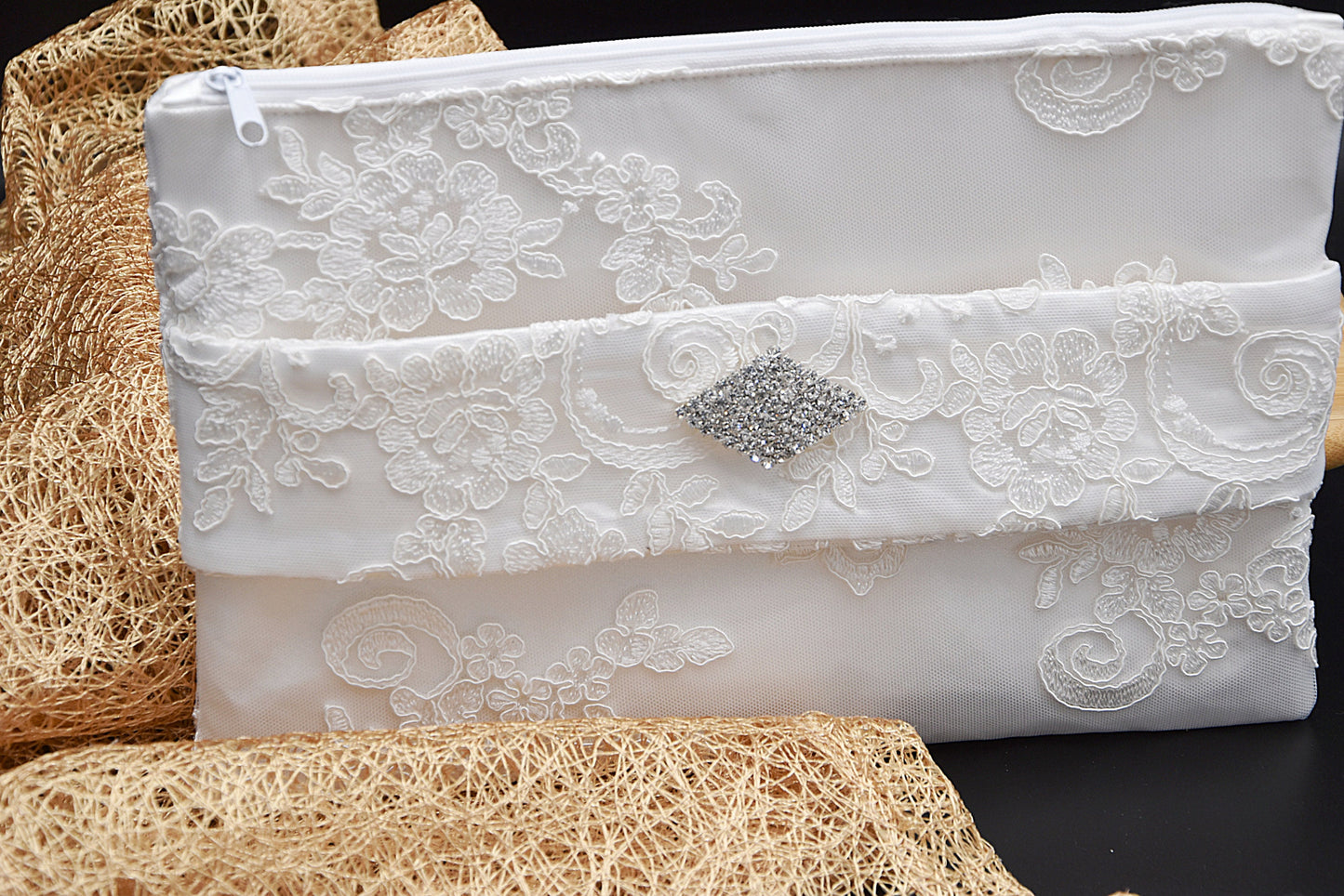 Bridal clutch bag in white lace with rhinestone brooch