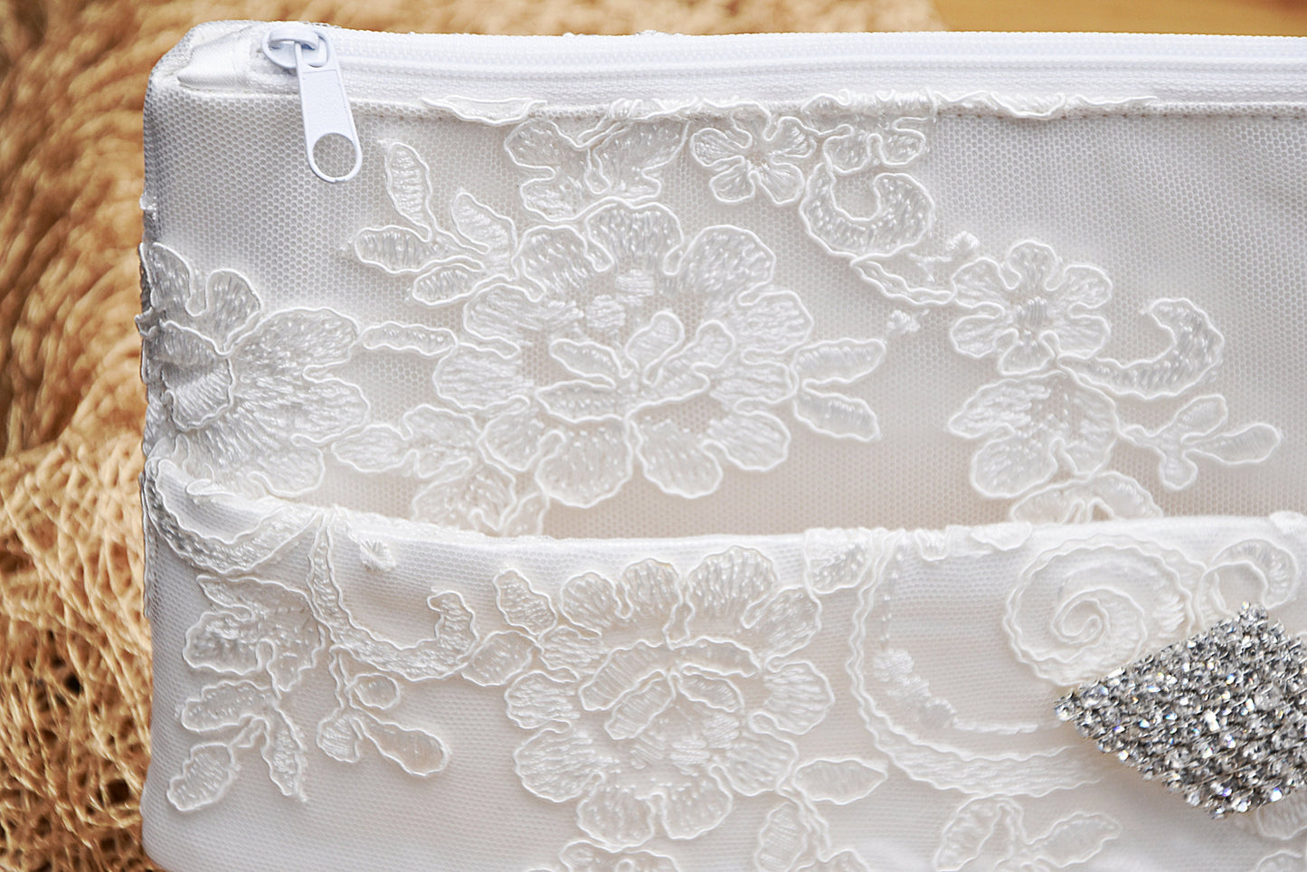 Bridal clutch bag in white lace with rhinestone brooch