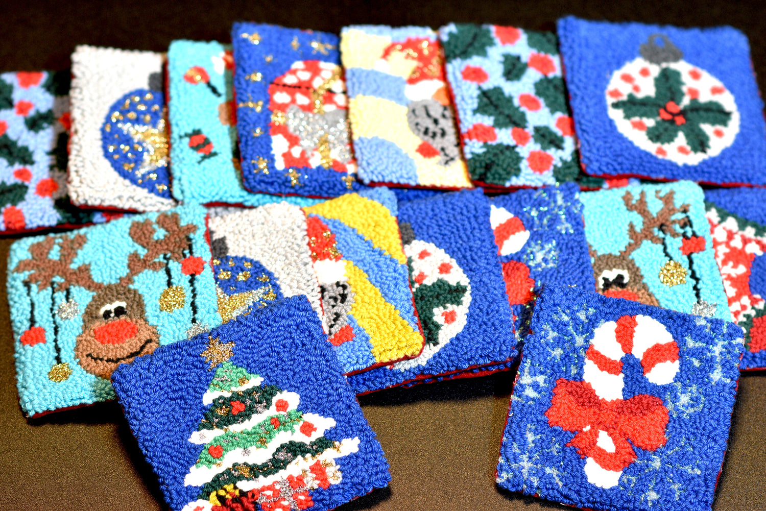 Several Christmas Punch needle Mug Rugs and coasters