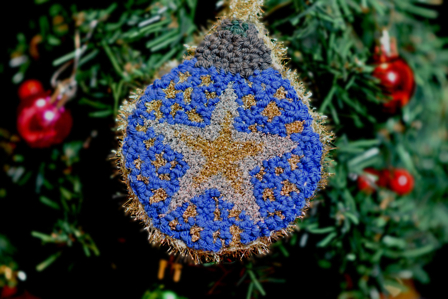 Christmas Punch needle ornaments - Sparkling star hanging on a Xmas tree