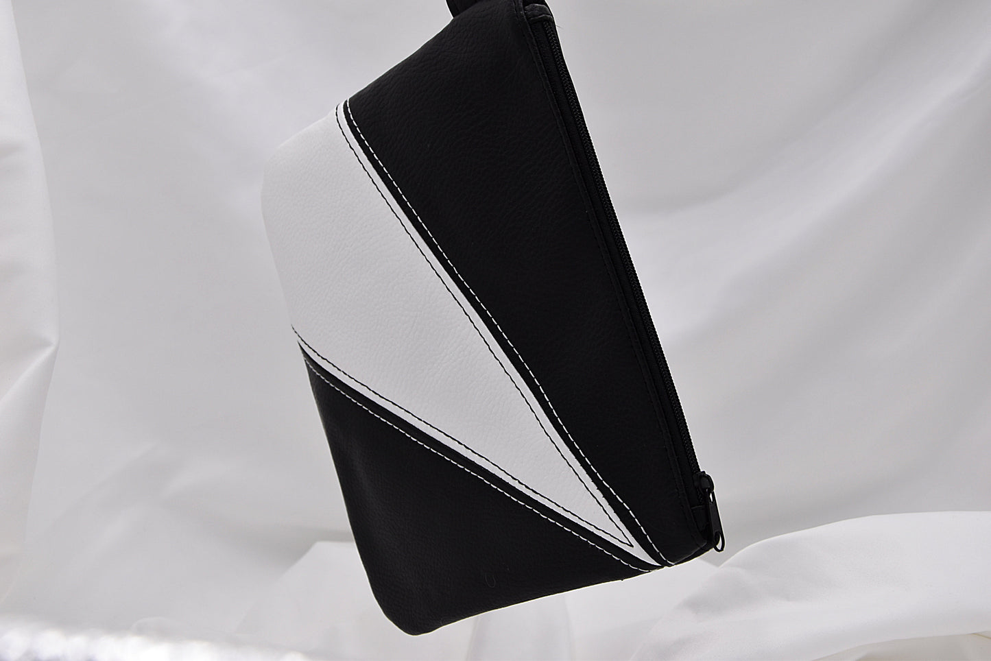 Black and white faux leather wristlet bag