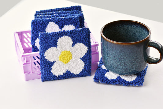 Punch needle mug coaster—white daisy on blue